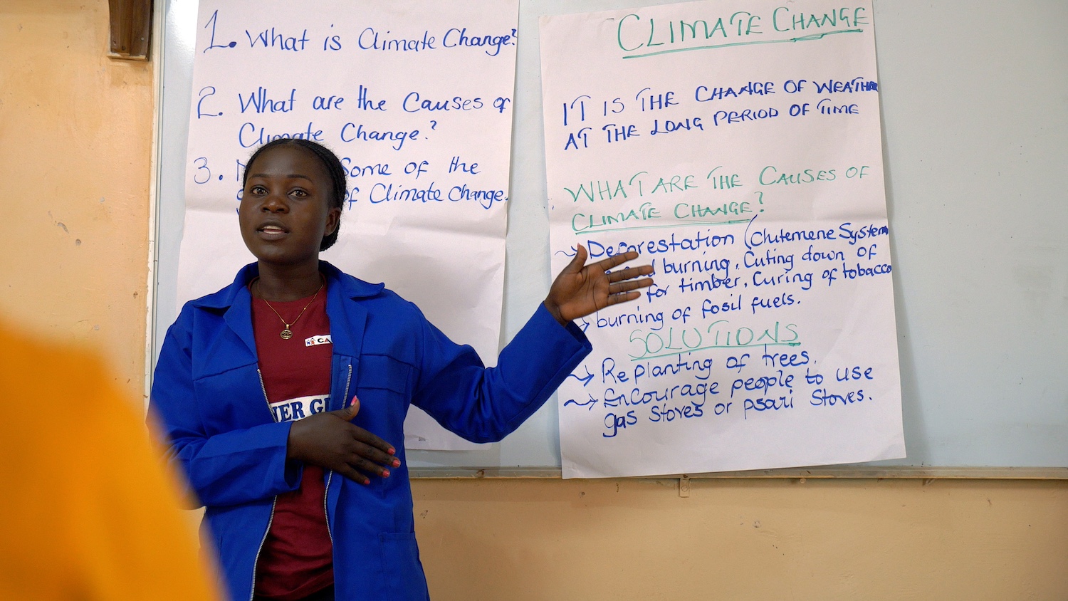 A Camfed agriculture guide teaching others about climate change. 