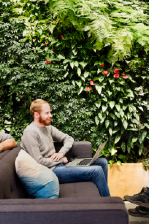 An-inclusive-environment-is-important-to-Etsy-and-the-green-wall-at-its-Brooklyn-HQ-adds-to-the-offices-vibe.png