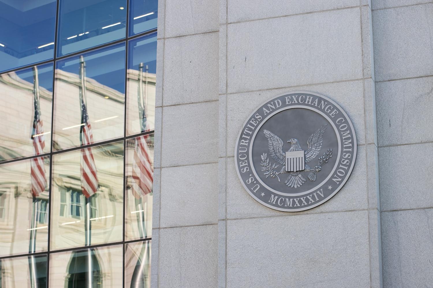 US Securities and Exchange Commission SEC — sign on headquarters with american flags