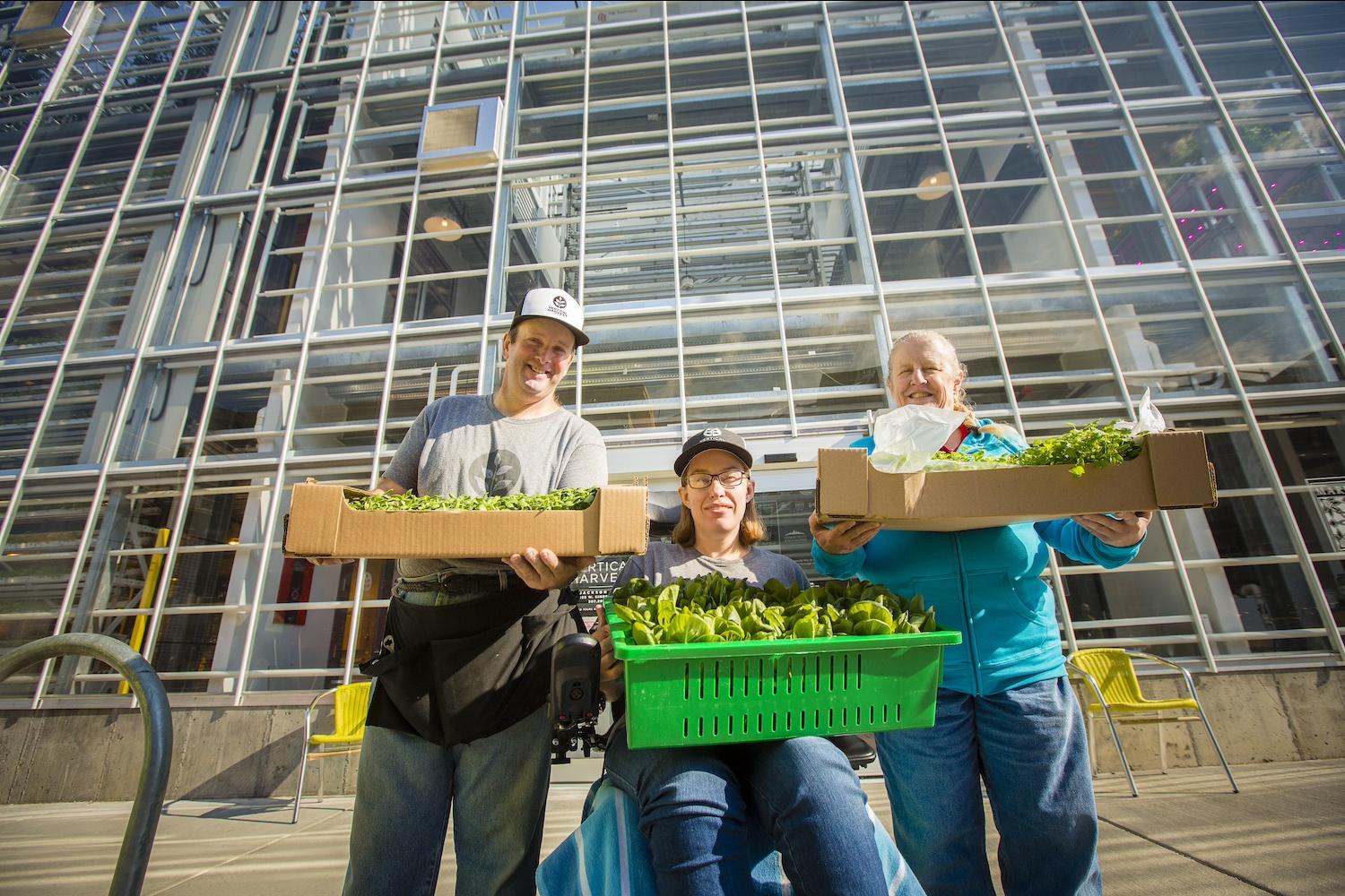 Employees outside of Vertical Harvest's greenhouse in Jackson Hole, Wyoming. 