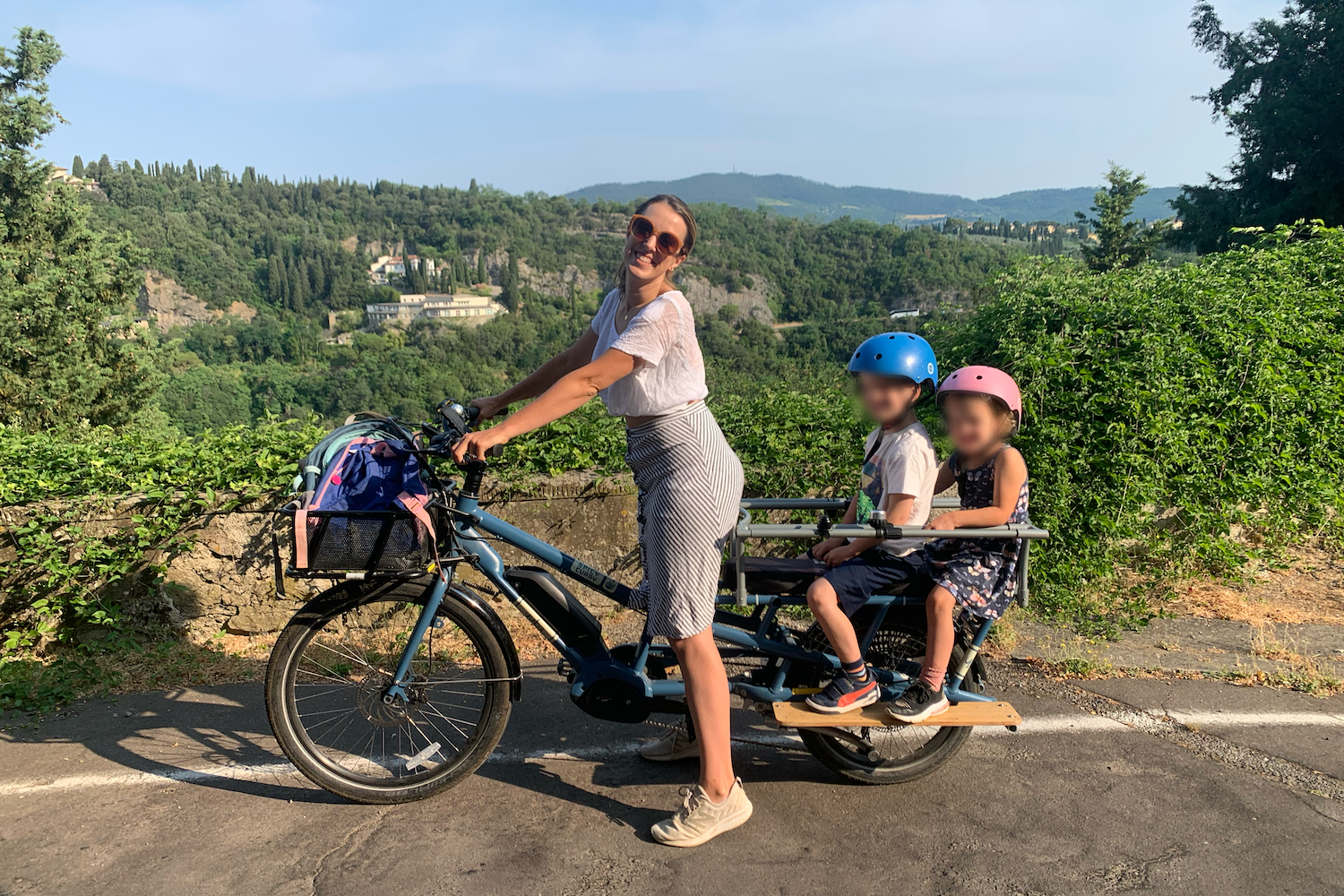 car-free family using a cargo bike in florence italy