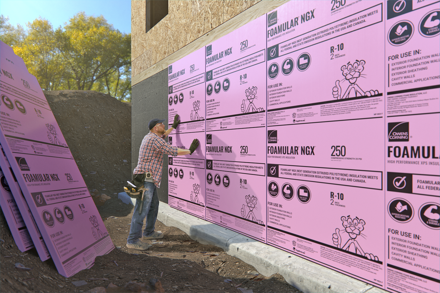 construction worker installing Owens Corning insulation