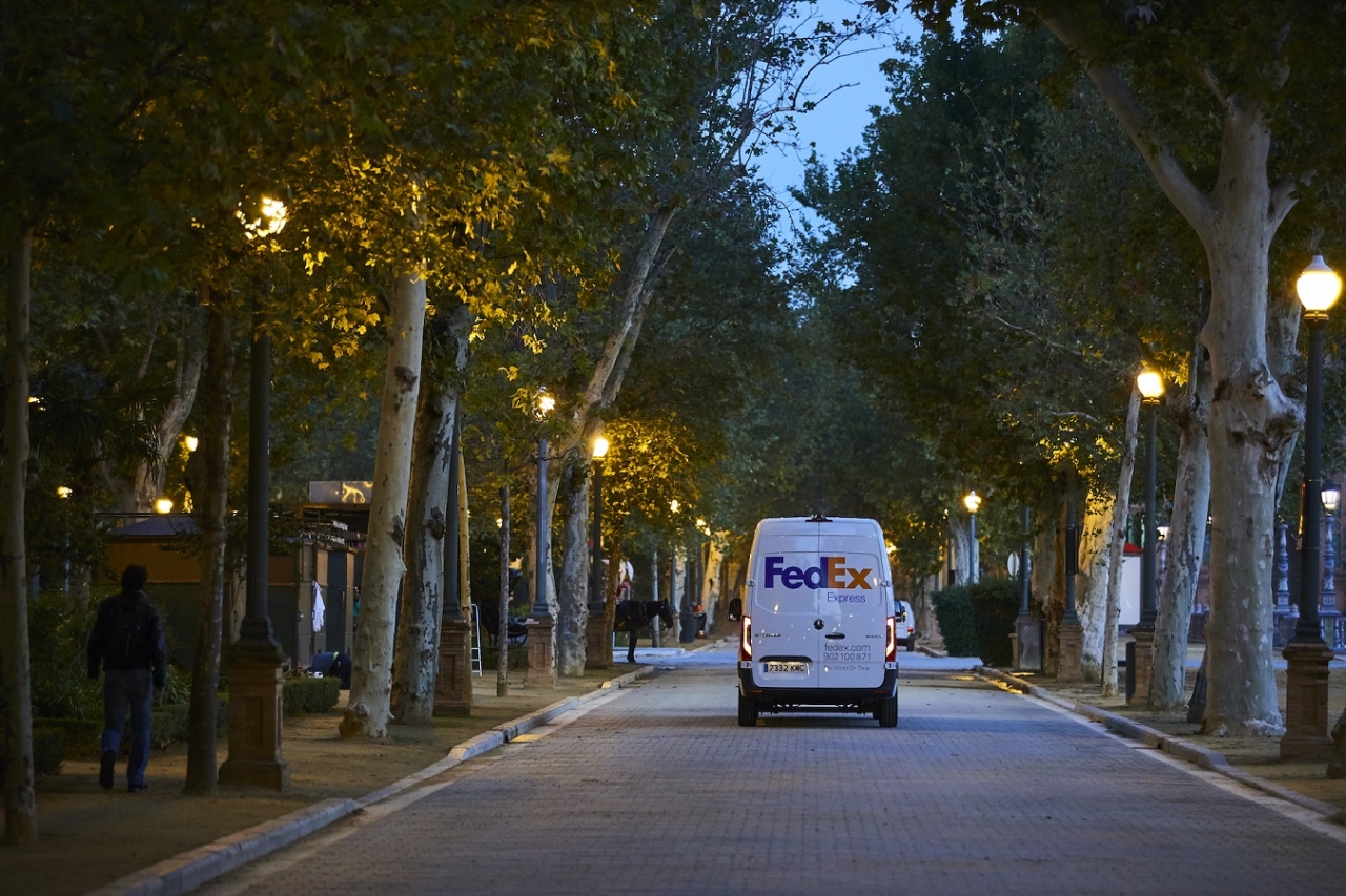 FedEx truck driving down a quiet street
