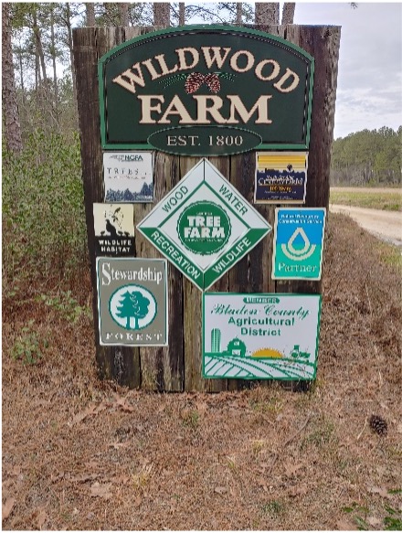 A sign reading "Wildwood Farm: EST. 1800"