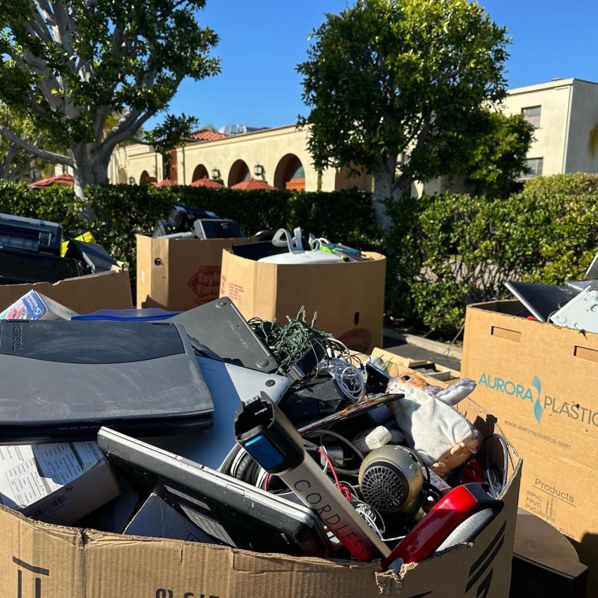 Cardboard boxes full of recycled electronics