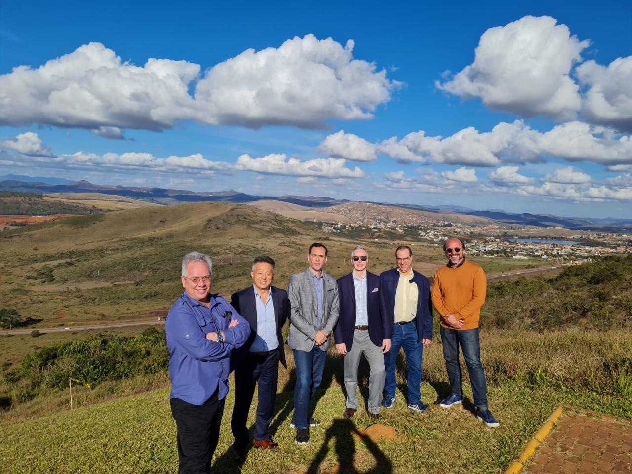 6 people standing on a hillside