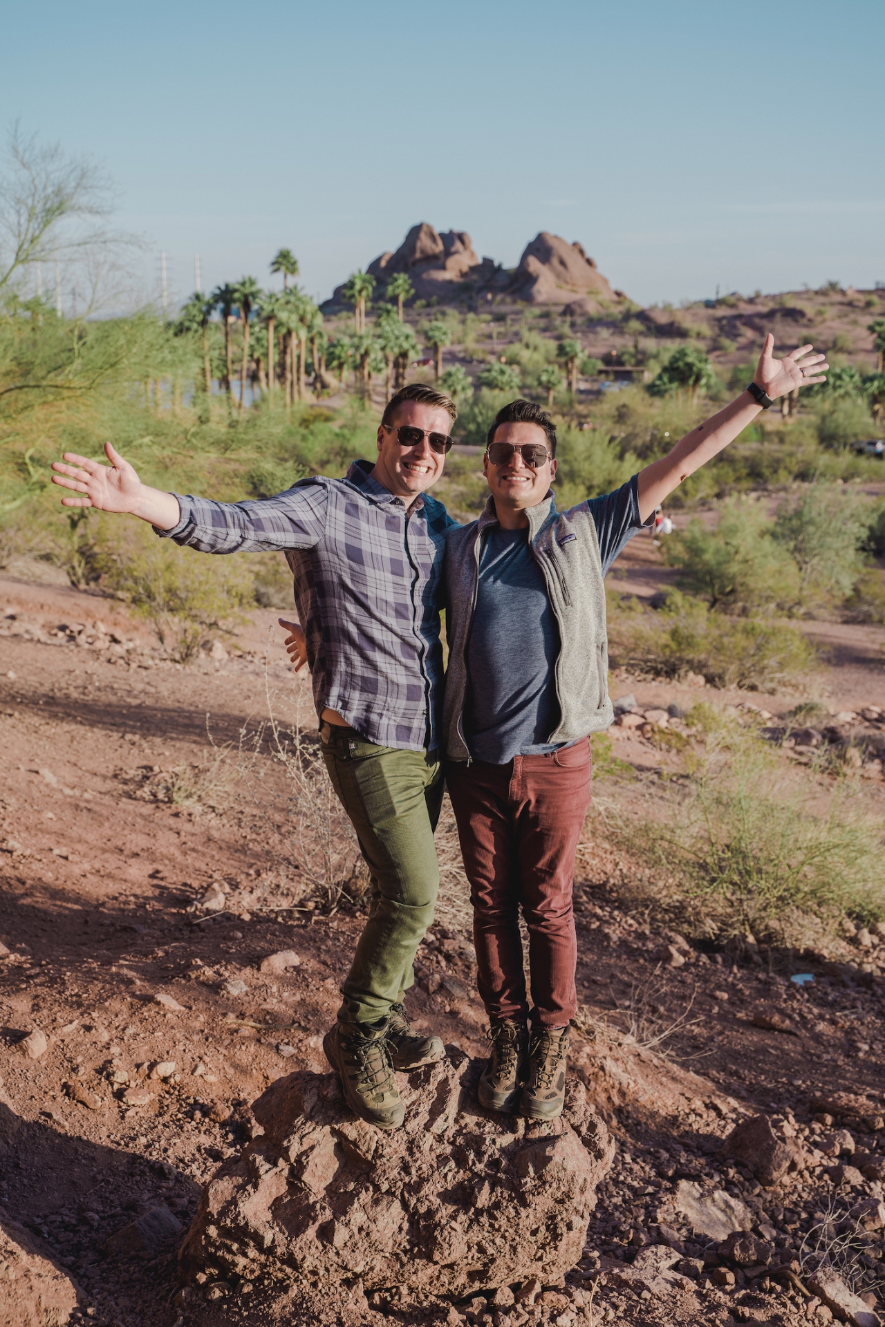 two people posing outside