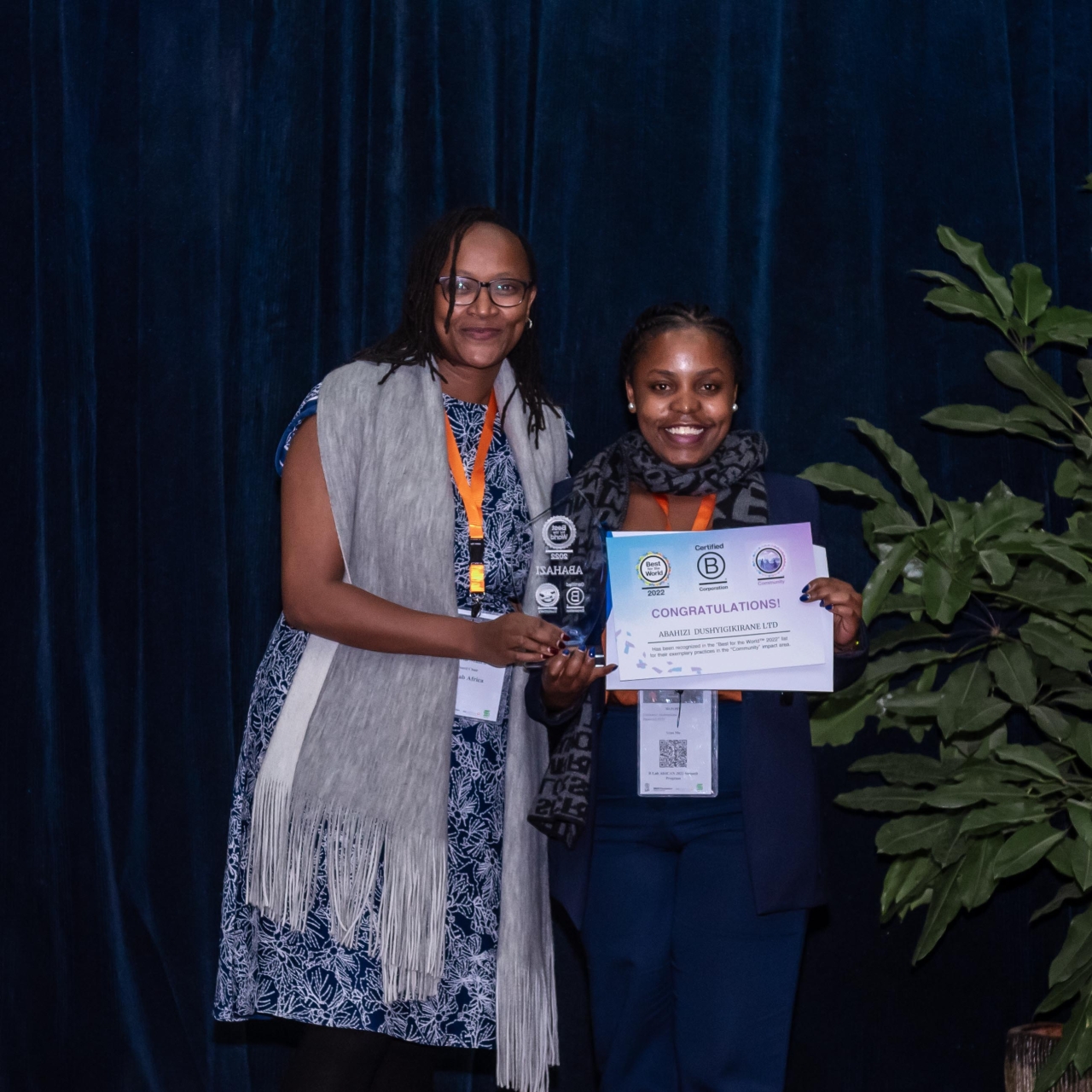 two people holding award 