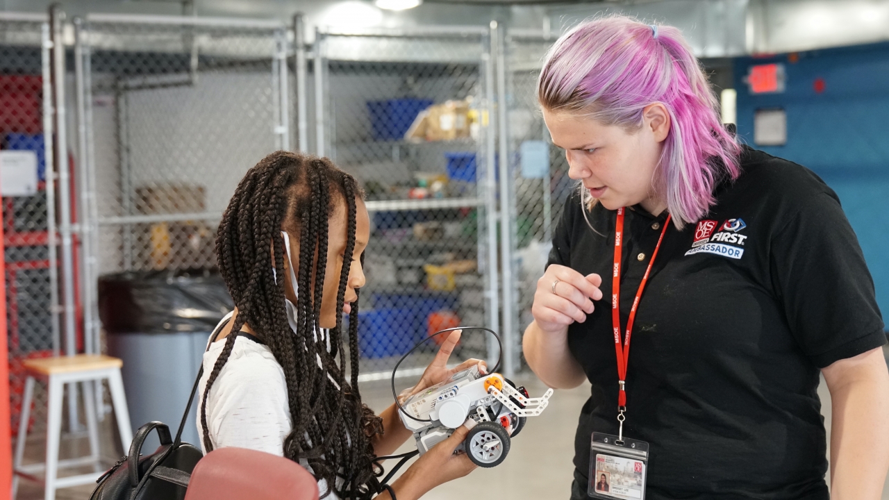 student working on her robot