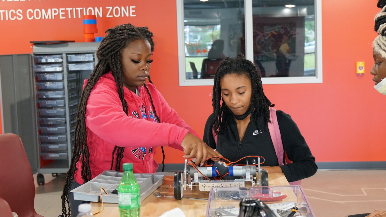 students working on robots