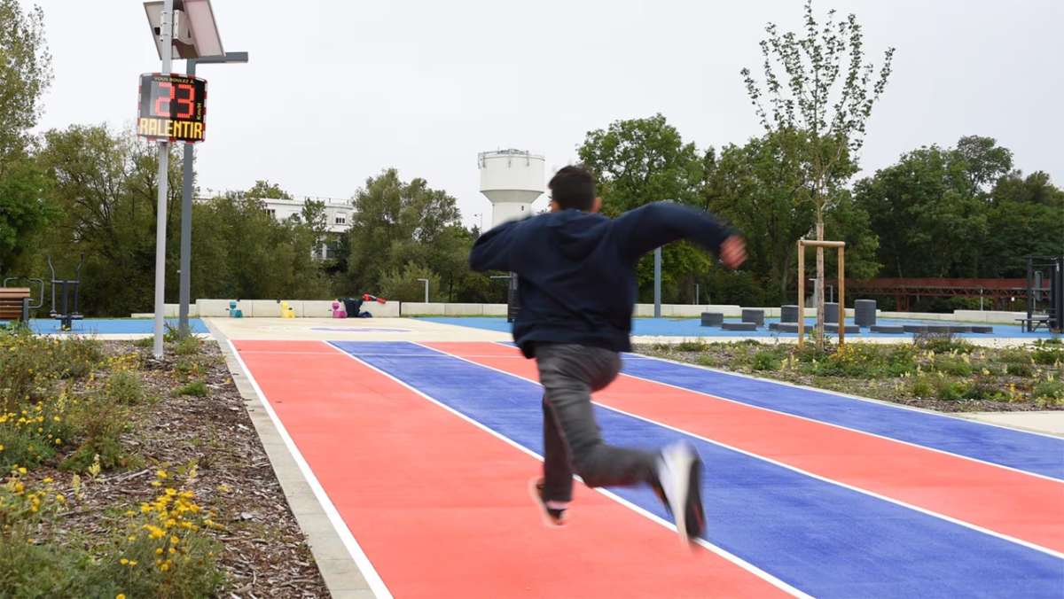 Person running on blue and red course