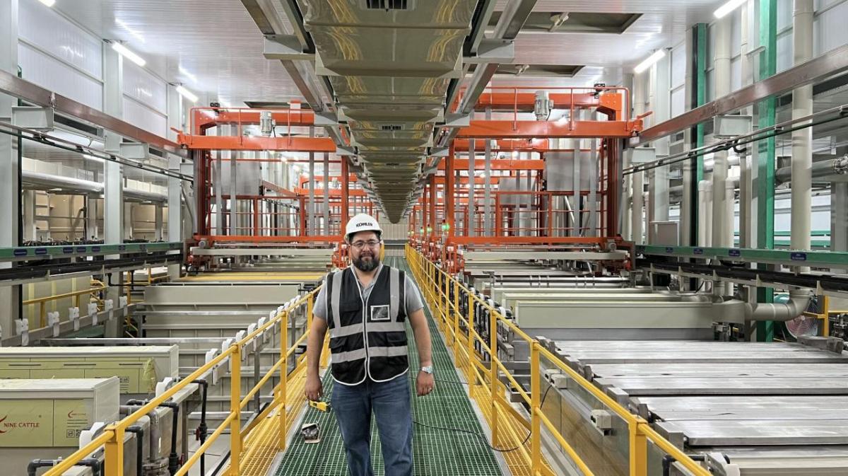 Person standing in a manufacturing plant
