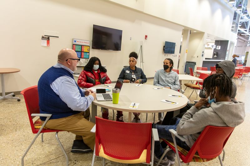 Whirlpool mentors and Benton Harbor High School students sitting at a round table