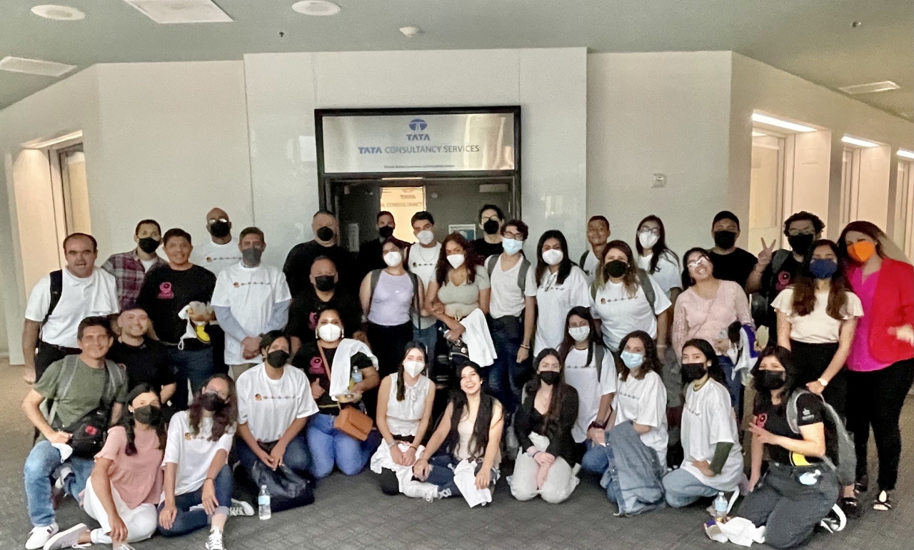 The group of 30 students pose for a photo