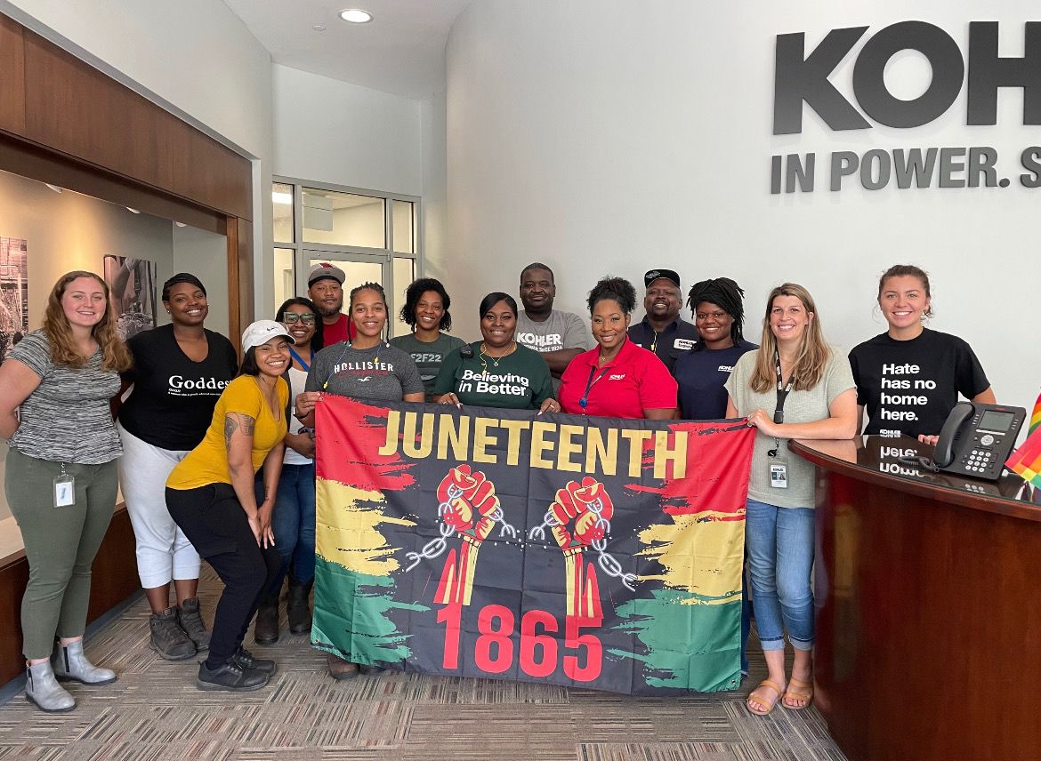 group with Juneteeth flag
