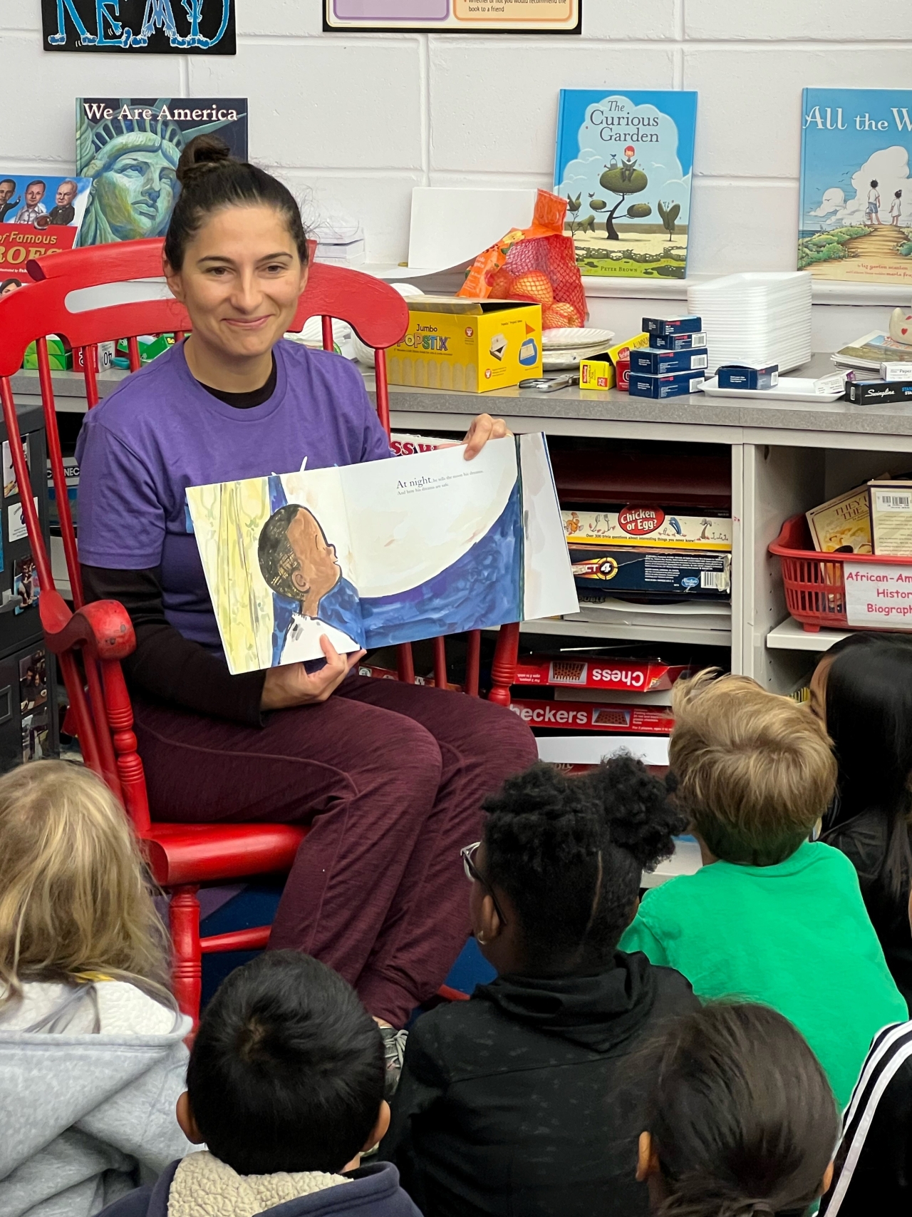 employee reading to kids