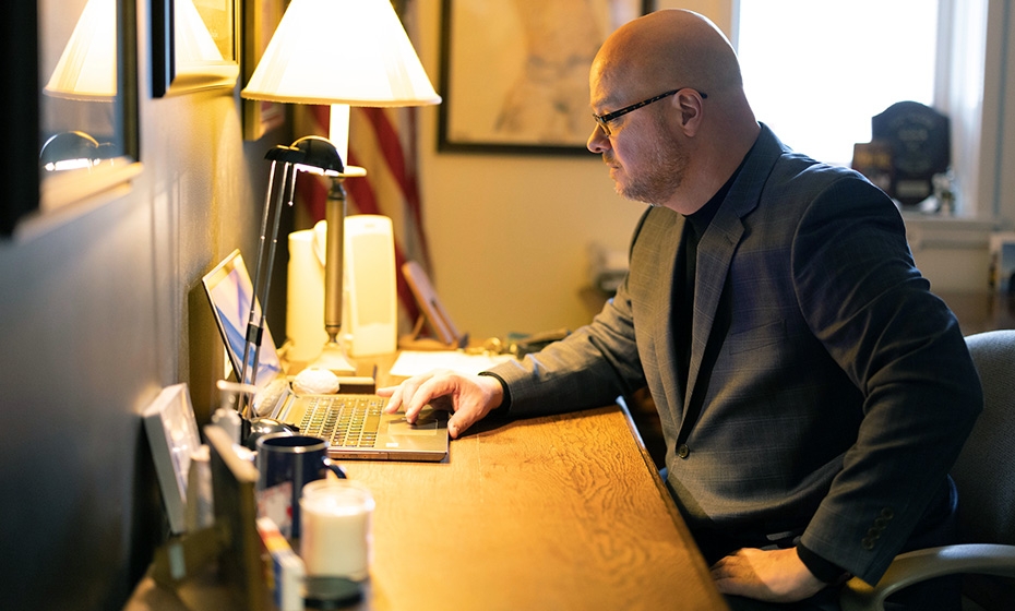 Andy Smith working on a laptop on a desk