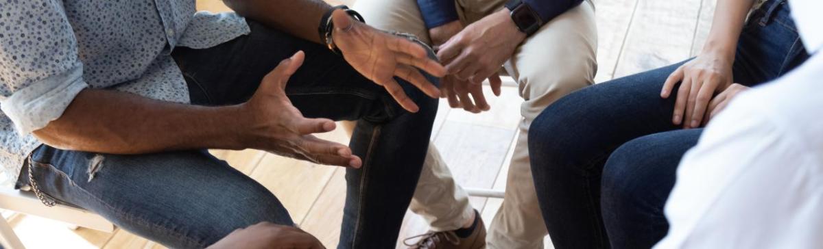 Hands of people talking in a group