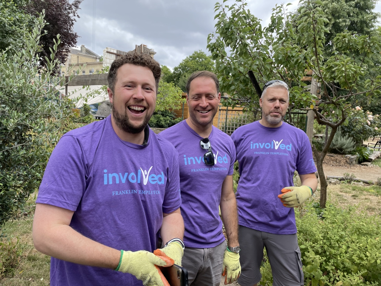 three people gardening