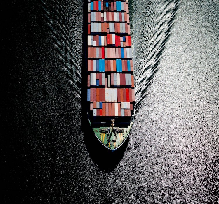Overhead view of a container ship on the sea.