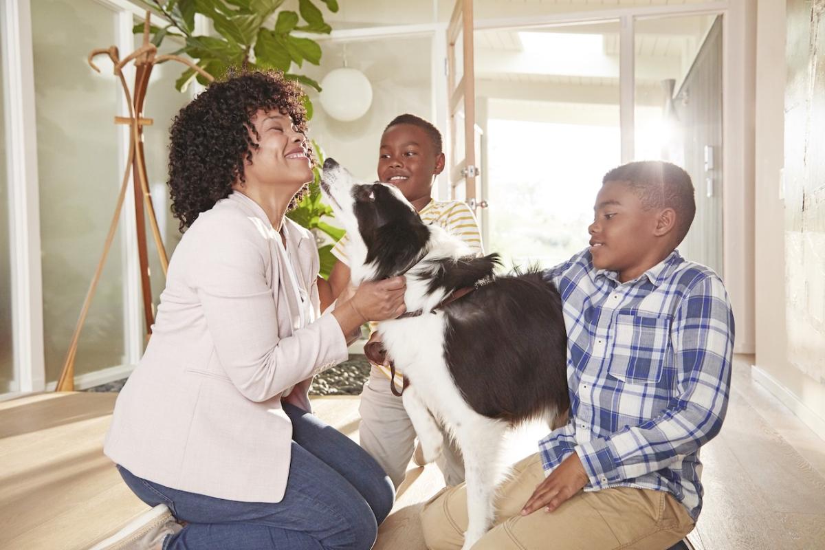 African American family shown with their dog.