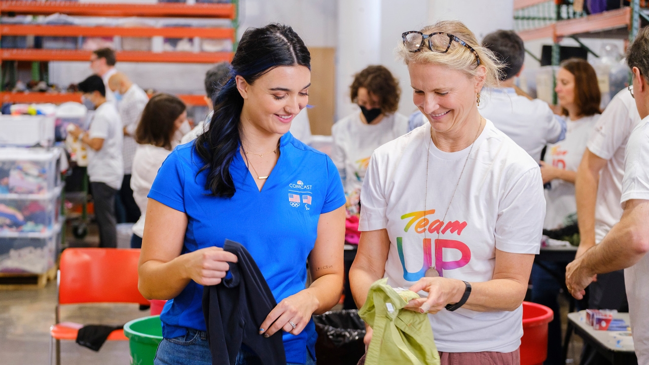 2 Volunteers sort clothes