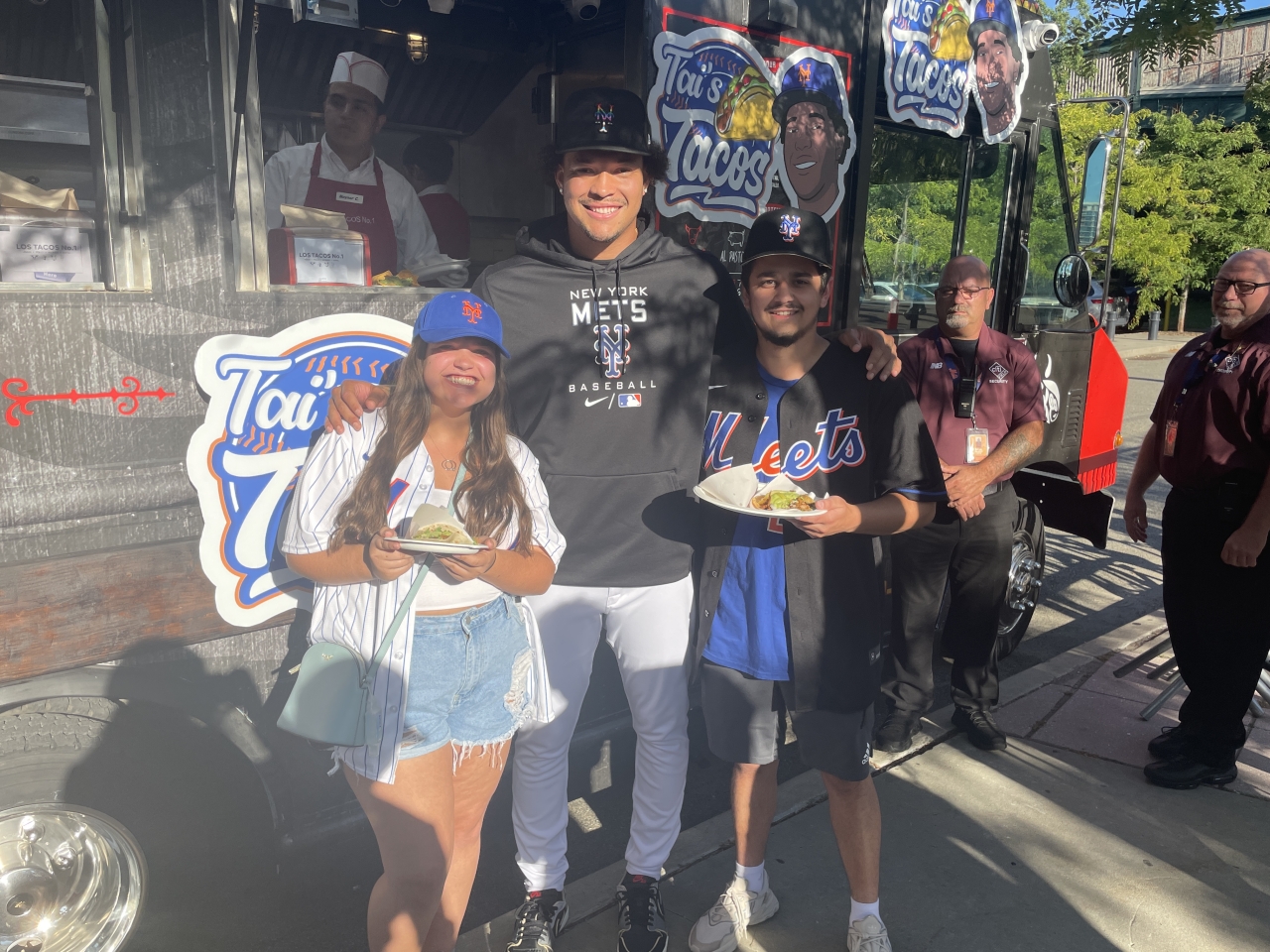 Kids posing in front of Tai's Taco Truck