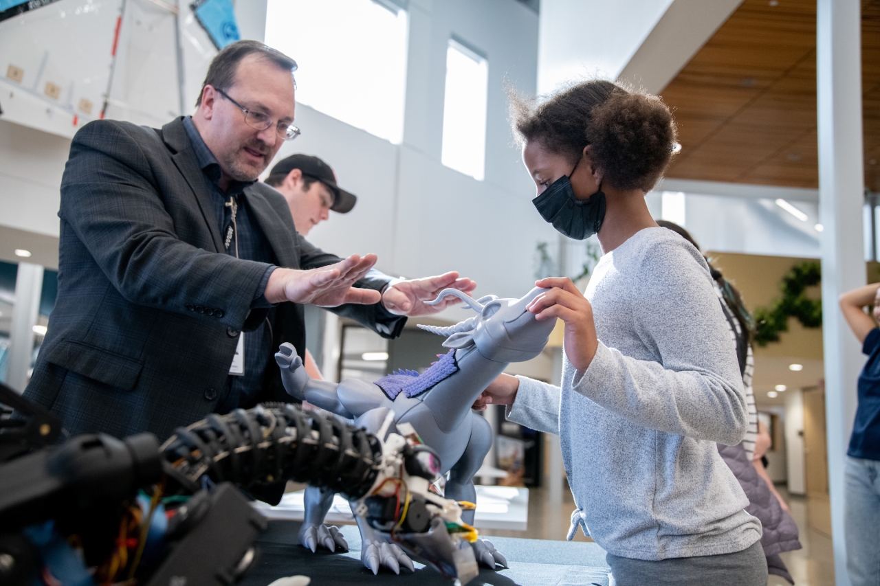 Frank Piotrowski and a student at St. Vrain Innovation Center with Belle's Dragon 