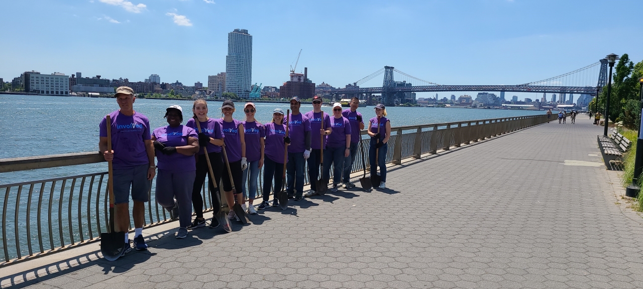 group standing beside a river