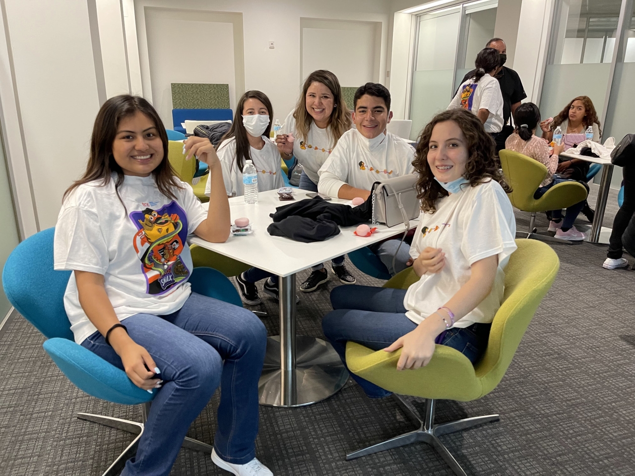 a group of students sitting at a table 