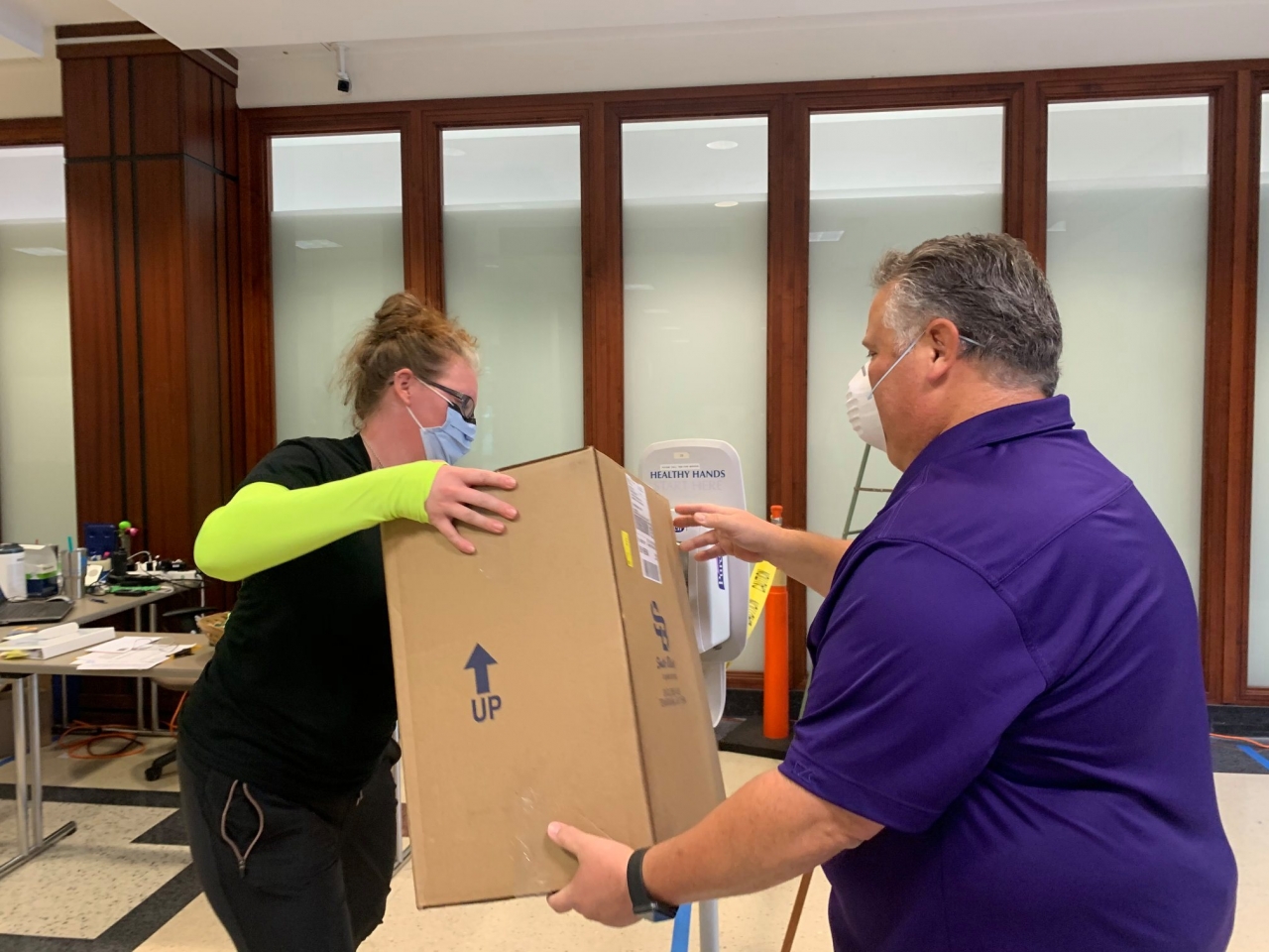 Box of supplies being handed over