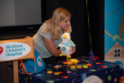 child with aflac duck