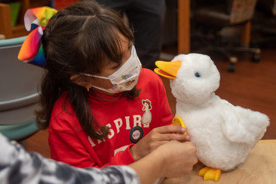 child with aflac duck