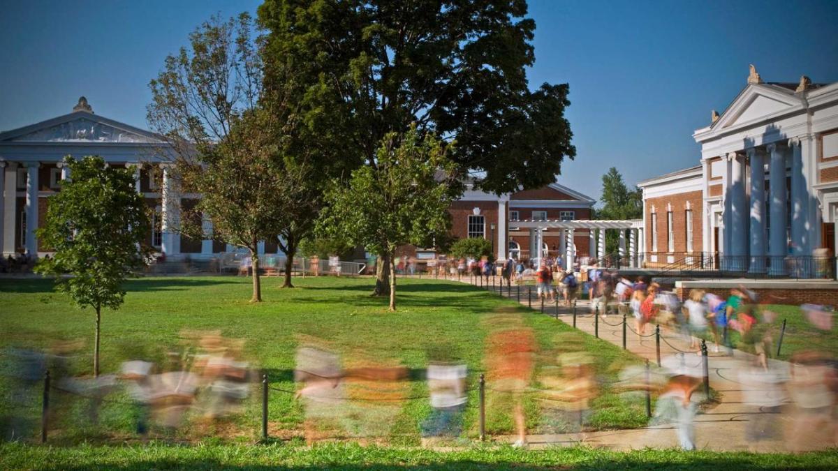 college campus with blurred images of students walking