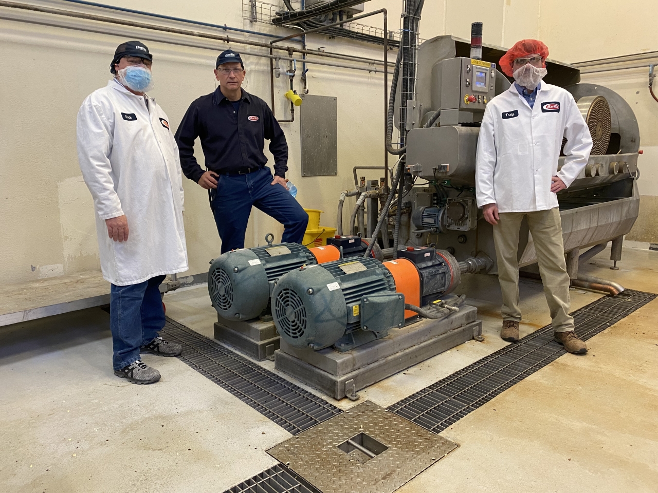 Barilla Plant Director Chris Buseman, Plant Mgr Bill Boula, National Grid Energy Efficiency Specialist Jay Snyder with die wash pump