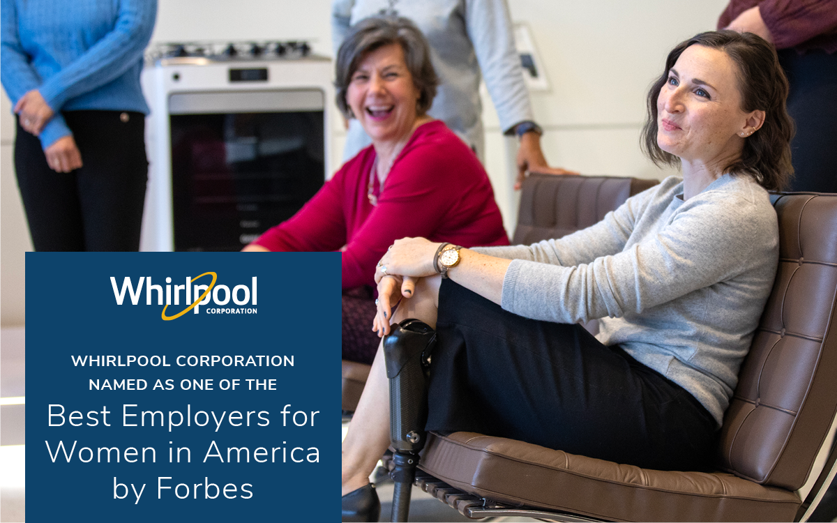 Two smiling people seated on a brown couch, others in the background. Whirlpool logo and Best Employers for Women in America by Forbes.