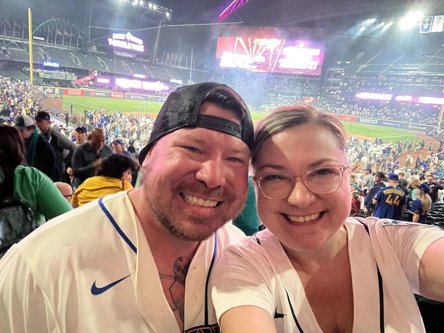 Brian Boosz and his wife at a baseball game.