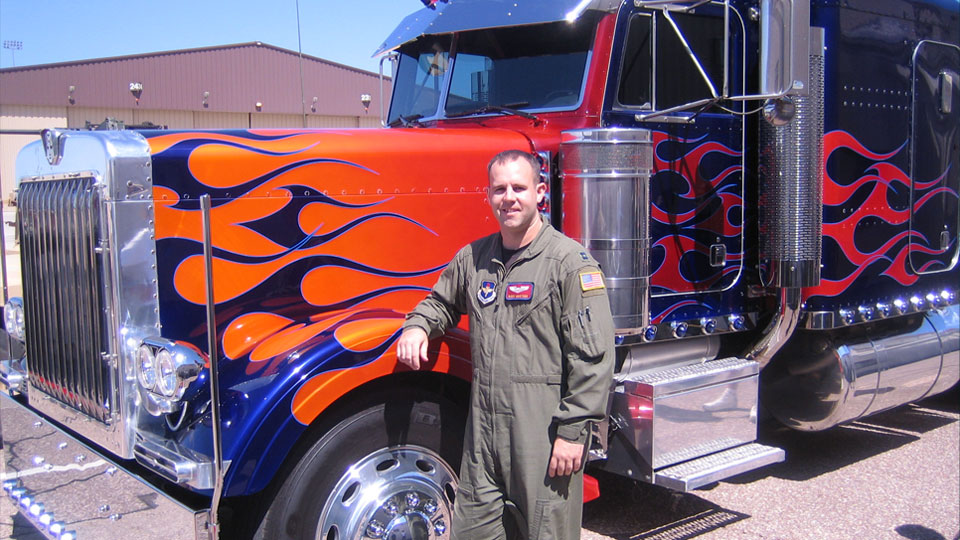 Buddy Martens with a truck painted with flames