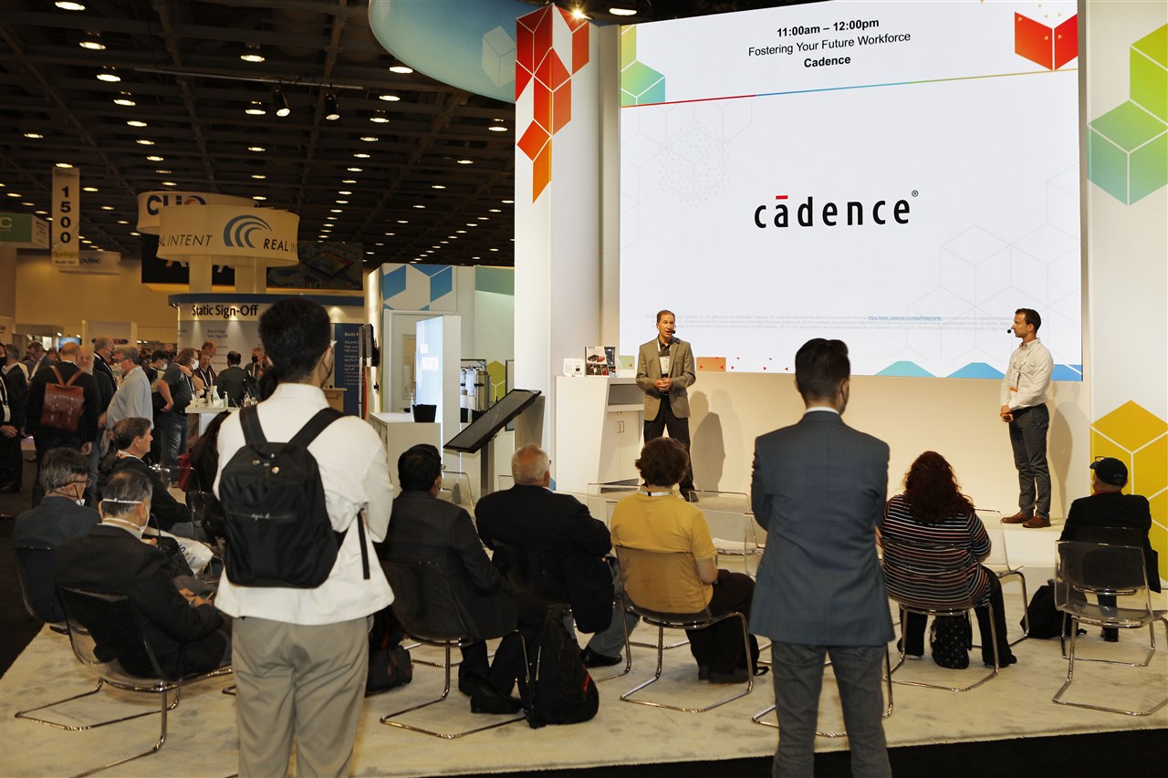 students listening to speaker, with Cadence screen behind speaker