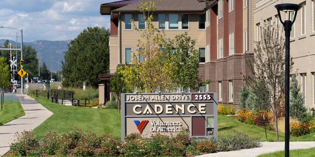 Cadence sign in front of building