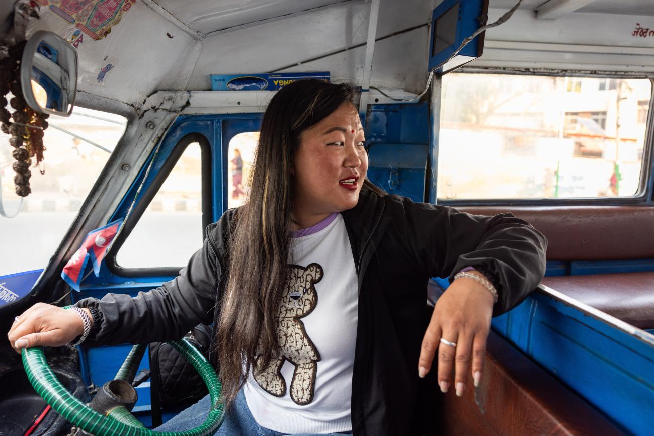 Sumita Rai in the vehicle she uses as a Safe Tempo driver in Nepal — Catalyzing Women’s Entrepreneurship