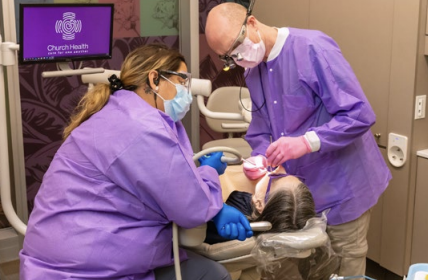 Health care professionals helping a patient