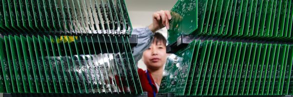 person sorting circuit boards