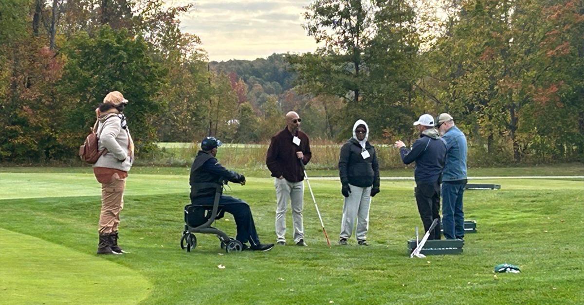 Participants, volunteers, and caregivers at the 2023 Stars, Stripes, and Links Event at Sand Ridge Golf Club in Chardon, Ohio.