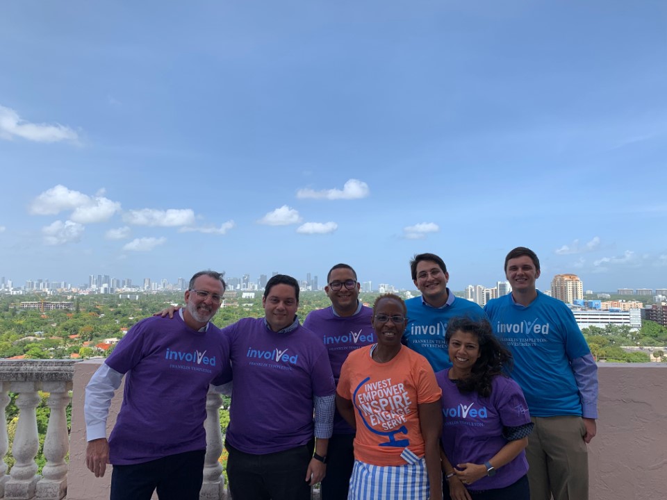 Group of employees wearing "Involved" T-shirts 