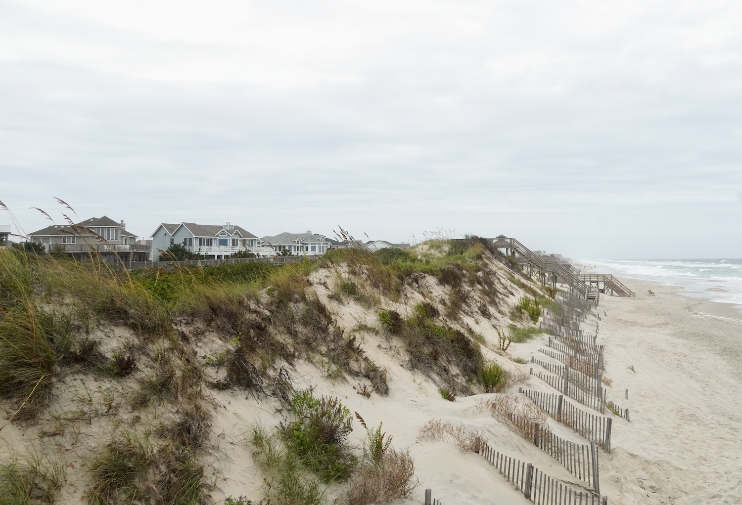 Homes at Corolla Light Resort built with a large buffer zone between them and the ocean to protect the dunes.