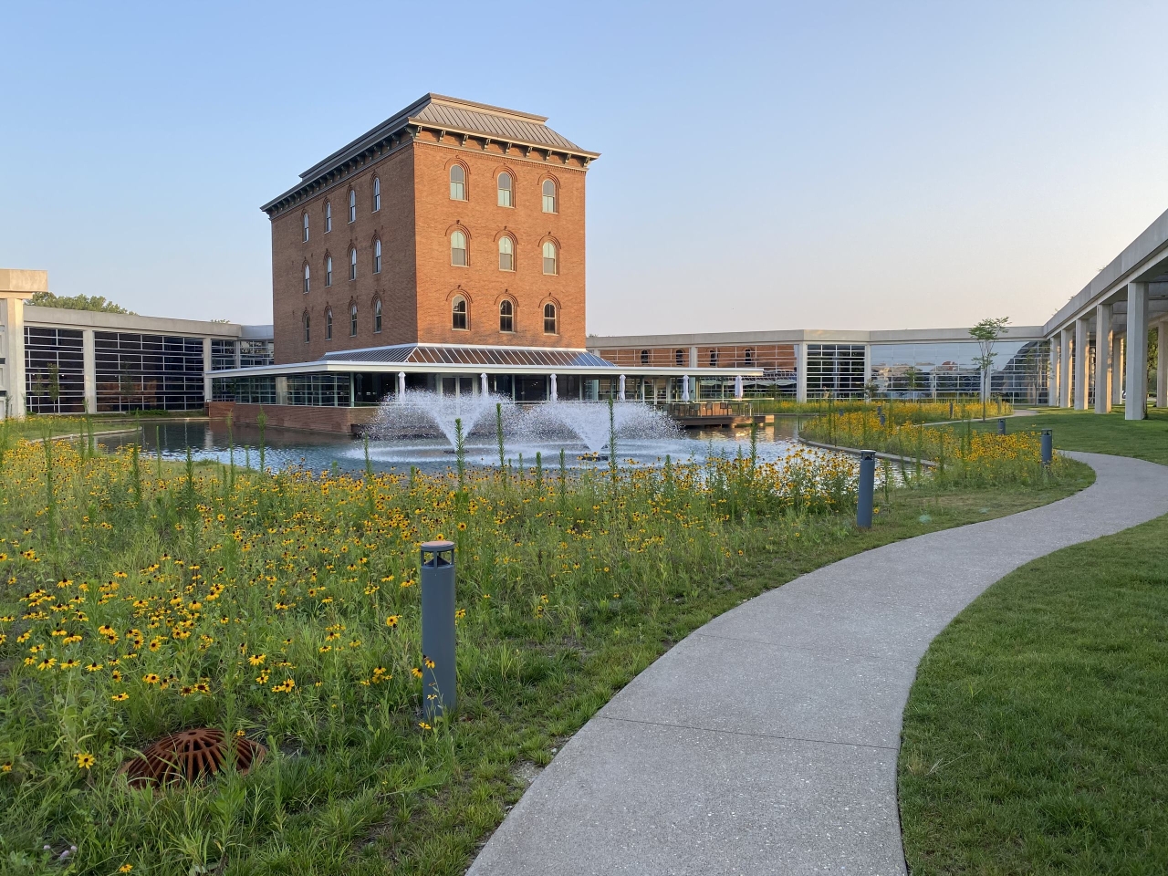 VoltStorage company headquarters with large building in the background and water fountain in the foreground