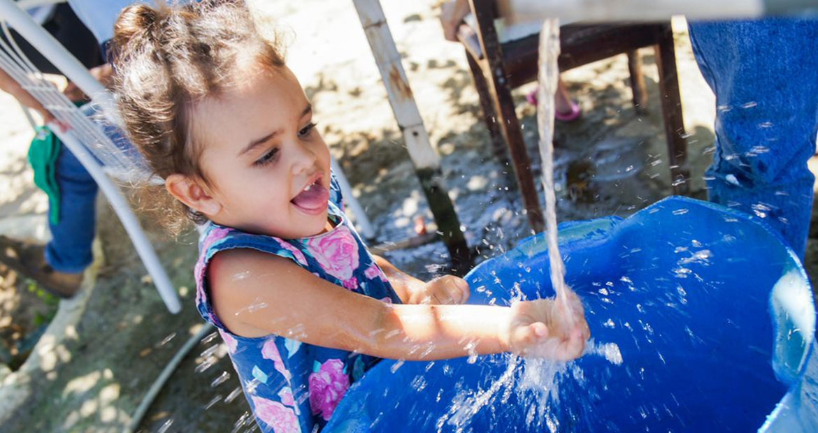 Child playing with water