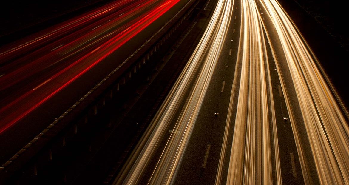 long exposure image of aerial shot of highway traffic