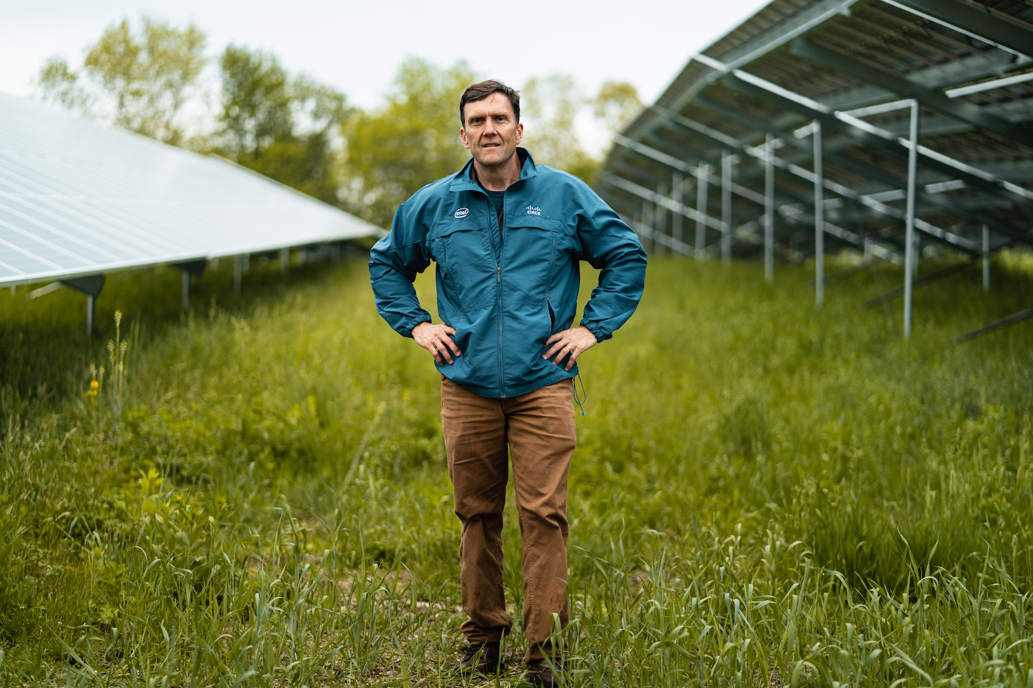 Chris Osika stands amid the agrivoltaics array on his farm in Poughkeepsie, New York. 